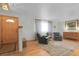 Bright living room with hardwood floors, neutral walls, and classic furnishings creating a welcoming atmosphere at 4381 S Estes St, Littleton, CO 80123