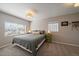 Well-lit bedroom with neutral walls, carpet, a window and stylish modern ceiling fan at 4530 S Pennsylvania St, Englewood, CO 80113