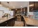 Modern kitchen features granite countertops, stainless steel appliances, tile backsplash, and lots of storage space at 4530 S Pennsylvania St, Englewood, CO 80113