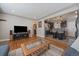 Spacious living room with hardwood floors opens to a modern kitchen, creating an inviting and connected living space at 4530 S Pennsylvania St, Englewood, CO 80113