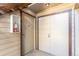 Building entrance with a well-maintained exterior, secure doors, and a convenient fire extinguisher for safety at 12047 E Harvard Ave # 103, Aurora, CO 80014