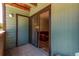Covered patio featuring sliding glass doors leading to an interior living space with exterior access at 12047 E Harvard Ave # 103, Aurora, CO 80014
