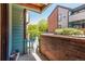 Patio with a brick wall, garden area, and cozy seating, perfect for outdoor relaxation and enjoyment at 12047 E Harvard Ave # 103, Aurora, CO 80014