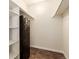Walk-in closet with shelving, and clothing rods, and safe offering ample storage and organization at 12047 E Harvard Ave # 103, Aurora, CO 80014