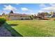 A beautiful backyard with lush lawn and a brick home at 5819 W Milan Pl, Denver, CO 80235