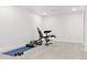Basement area featuring fitness equipment and ample space for exercise, perfect for a home gym at 5926 S Jellison St # B, Littleton, CO 80123