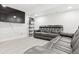 Finished basement with plush carpeting and a comfortable leather reclining sofa, perfect for relaxation at 5926 S Jellison St # B, Littleton, CO 80123