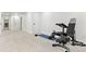 Spacious basement area with gym equipment, offering potential for recreation or fitness activities at 5926 S Jellison St # B, Littleton, CO 80123