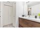 Modern bathroom featuring a wood vanity, neutral walls, and minimalist decor at 5926 S Jellison St # B, Littleton, CO 80123