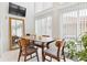 Bright dining area featuring large windows, neutral walls, and minimalist decor at 5926 S Jellison St # B, Littleton, CO 80123