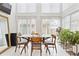 Bright dining area featuring large windows, neutral walls, and minimalist decor at 5926 S Jellison St # B, Littleton, CO 80123
