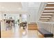 Bright and airy entryway with hardwood floors, stairs leading to the upper level, and an open floor plan at 5926 S Jellison St # B, Littleton, CO 80123