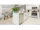 Updated kitchen featuring stainless steel appliances, white cabinets, and an open concept design at 5926 S Jellison St # B, Littleton, CO 80123