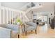 Bright and open living space with hardwood floors, staircase, and neutral color scheme at 5926 S Jellison St # B, Littleton, CO 80123