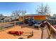Inviting back deck featuring an outdoor seating area and grill, perfect for enjoying outdoor living at 7970 Wolff Ct, Westminster, CO 80030