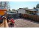 Backyard featuring a mix of brick and gravel, complete with an outdoor dining set for enjoying meals al fresco at 7970 Wolff Ct, Westminster, CO 80030