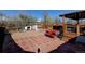 Backyard highlighting a brick patio, covered deck, and ample room for outdoor seating at 7970 Wolff Ct, Westminster, CO 80030