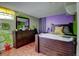 Bedroom with wood-frame bed and dresser, complemented by bright walls and hardwood floors at 7970 Wolff Ct, Westminster, CO 80030