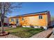 Charming home featuring a well-maintained front yard, appealing landscaping, and inviting entrance at 7970 Wolff Ct, Westminster, CO 80030