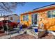 Charming single-story home with a brightly colored exterior, solar panels and well-maintained landscaping at 7970 Wolff Ct, Westminster, CO 80030