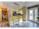 Bright kitchen featuring stainless steel appliances, granite countertops, and an island with bar stool seating at 7970 Wolff Ct, Westminster, CO 80030