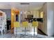 Bright kitchen featuring stainless steel appliances, granite countertops, and an island with bar stool seating at 7970 Wolff Ct, Westminster, CO 80030
