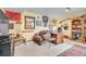 Cozy basement featuring a comfortable armchair, desk, and built-in shelving at 29857 Park Village Dr, Evergreen, CO 80439
