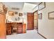 Bright home office with ample natural light, warm wall color and wood furniture at 29857 Park Village Dr, Evergreen, CO 80439