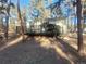 Charming cabin with a spacious wood deck surrounded by trees and a natural landscape at 36351 County Road 21, Elizabeth, CO 80107