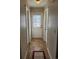 Hallway featuring tile flooring, fresh white paint and ample light, offering a clean and inviting entrance at 36351 County Road 21, Elizabeth, CO 80107