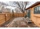 Wooden patio and fenced in yard are great for entertaining at 53 S Eagle Cir, Aurora, CO 80012