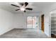 This bedroom has carpet and a glass sliding door that leads to the backyard area at 53 S Eagle Cir, Aurora, CO 80012