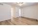 Bright bedroom with sleek floors, a ceiling fan and natural light from an open doorway at 112 W Sterne Pkwy, Littleton, CO 80120