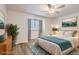 Bright bedroom with new hardwood floors, neutral walls and a decorative ceiling fan at 112 W Sterne Pkwy, Littleton, CO 80120