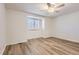 This spacious bedroom features a ceiling fan, and a window with plantation shutters at 112 W Sterne Pkwy, Littleton, CO 80120