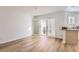 Bright and airy dining space with open patio doors and countertop overlooking the modern kitchen area at 112 W Sterne Pkwy, Littleton, CO 80120