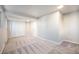 Clean bedroom with neutral carpet, white trim, and a closet with sliding doors at 7077 Ammons St, Arvada, CO 80004