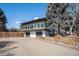 Unique exterior showing spacious parking, garages and second story windows at 7077 Ammons St, Arvada, CO 80004