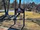 Jefferson County Open Space sign in a park with a playground and tennis court at 7077 Ammons St, Arvada, CO 80004