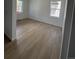 Bright bedroom featuring hardwood floors, ample natural light, and a peaceful atmosphere at 8836 Whiteclover St, Littleton, CO 80125