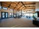 Spacious community center with high ceilings, fireplace, lounge area, and tables at 8836 Whiteclover St, Littleton, CO 80125