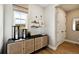 Cozy entryway with stylish storage and a window offering outdoor views at 8836 Whiteclover St, Littleton, CO 80125