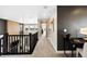 Upstairs hallway featuring neutral walls, a dark accent wall, and contemporary decor at 8836 Whiteclover St, Littleton, CO 80125
