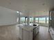 Open concept kitchen featuring a large island, stainless appliances, and a seamless transition to the living area at 8836 Whiteclover St, Littleton, CO 80125