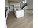 Modern kitchen with a large island, stainless steel appliances, and an open layout at 8836 Whiteclover St, Littleton, CO 80125
