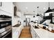 Modern kitchen featuring white cabinets, stainless steel appliances, and a stylish design at 8836 Whiteclover St, Littleton, CO 80125