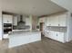 Well-equipped kitchen boasts a spacious island, modern appliances, and elegant countertops at 8836 Whiteclover St, Littleton, CO 80125
