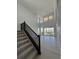 Bright living room featuring an open floor plan, hardwood floors, and large windows offering scenic views at 8836 Whiteclover St, Littleton, CO 80125