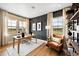 Home office featuring built-in shelving, a large desk, and scenic views at 8836 Whiteclover St, Littleton, CO 80125