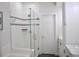 Modern bathroom featuring a glass-enclosed shower with white tiling and gray accents at 2147 N Downing St, Denver, CO 80205